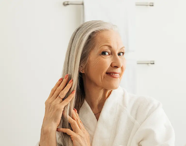 senior-woman-admiring-hair